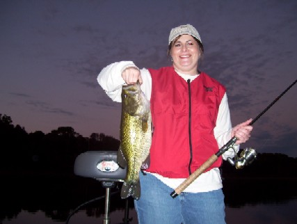 A very Happy angler with her biggest Bass